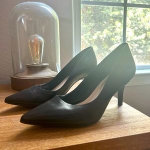 Black leather pumps